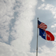 A U.S. flag and American University flag fly on the university campus Aug. 15, 2006, in Washington, D.C.
Alex Wong/Getty Images